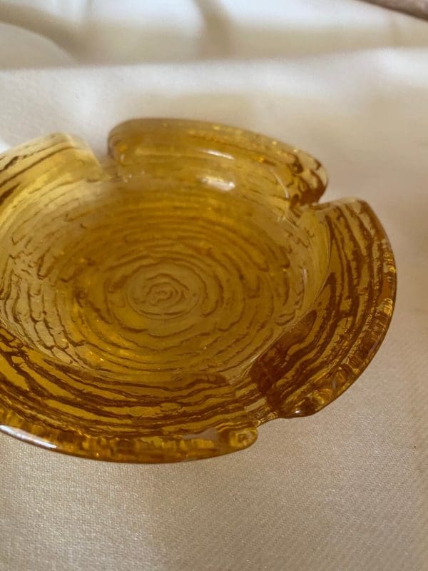 Vintage amber glass ashtrays close