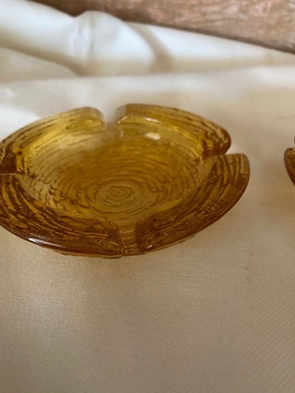 Vintage amber glass ashtrays set top