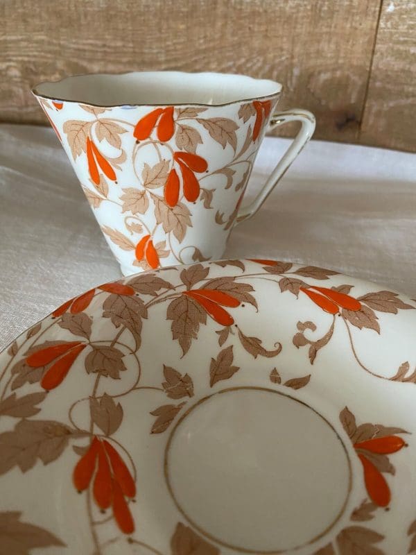 Art Deco tea cup Orange Flowers close up of saucer