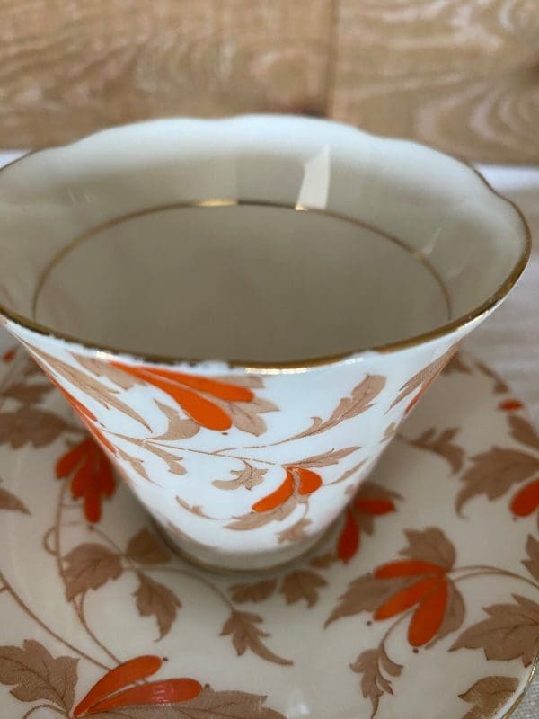 Art Deco tea cup Orange Flowers closeup