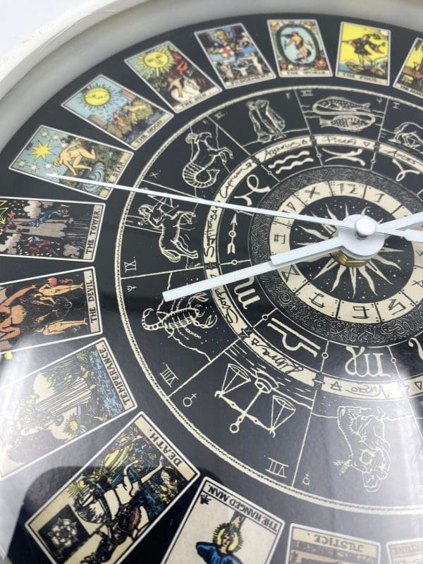 Zodiac Wall Clock front, black with zodiac signs, and astrological illustrations unique.