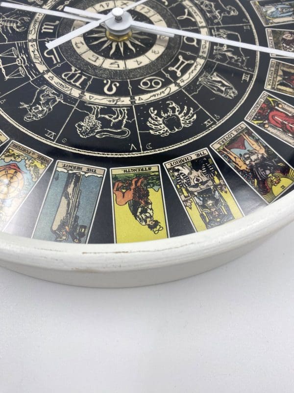 Zodiac Wall Clock front, black with zodiac signs, and astrological illustrations white frame