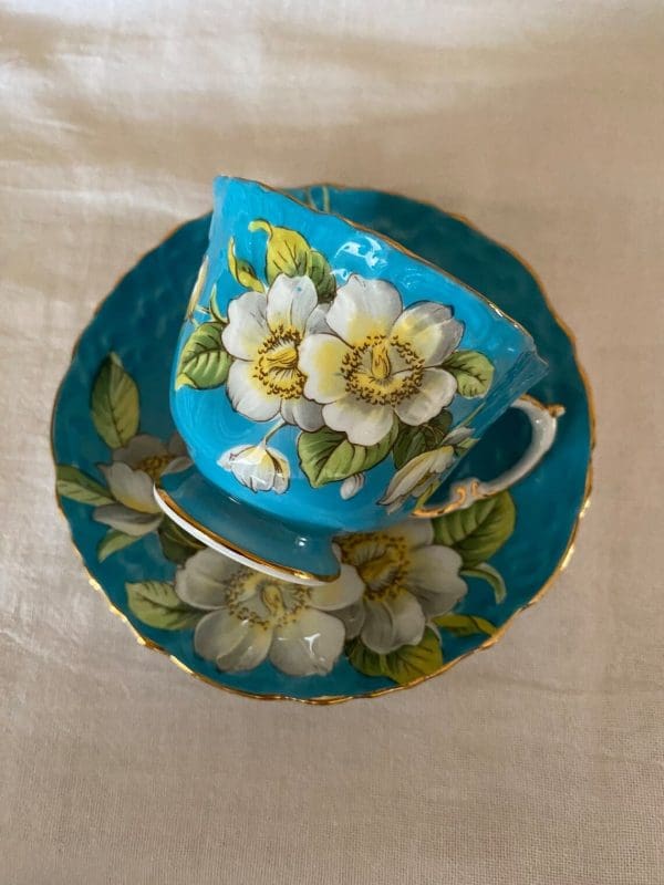 Aynsley England bone china tea cup 1930s in blue and yellow with flower. Tea cup on side