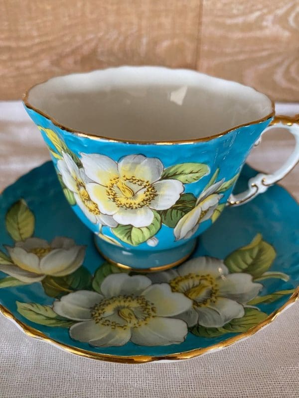 Aynsley England bone china tea cup 1930s in blue and yellow with flower standard view close