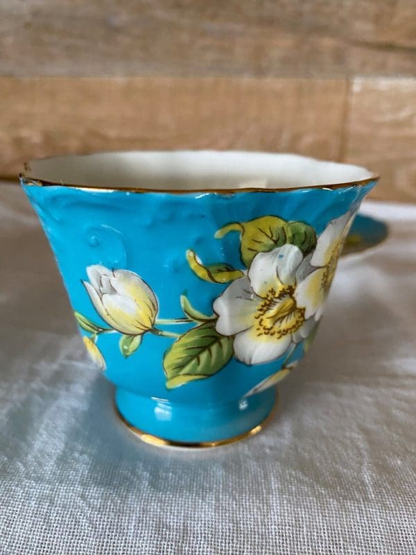 Aynsley England bone china tea cup 1930s in blue and yellow with flower teac cup close up 2