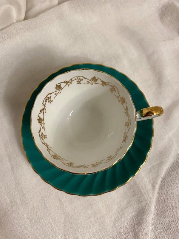 Aynsley tea cup and saucer green and gold 1950s top view