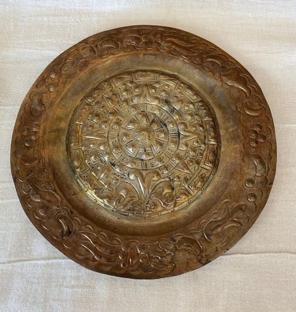 Copper Aztec Calendar Plate laying flat