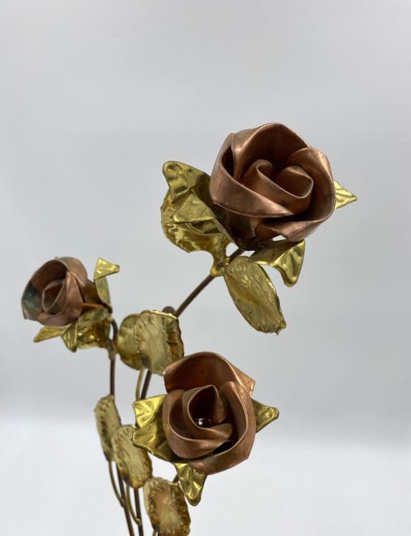 vintage brass wall decor close of roses