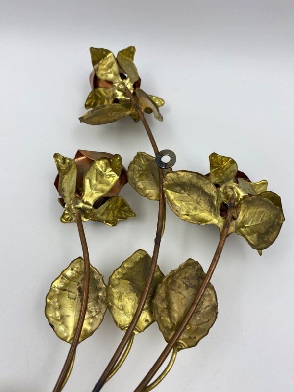 vintage brass wall decor back of roses