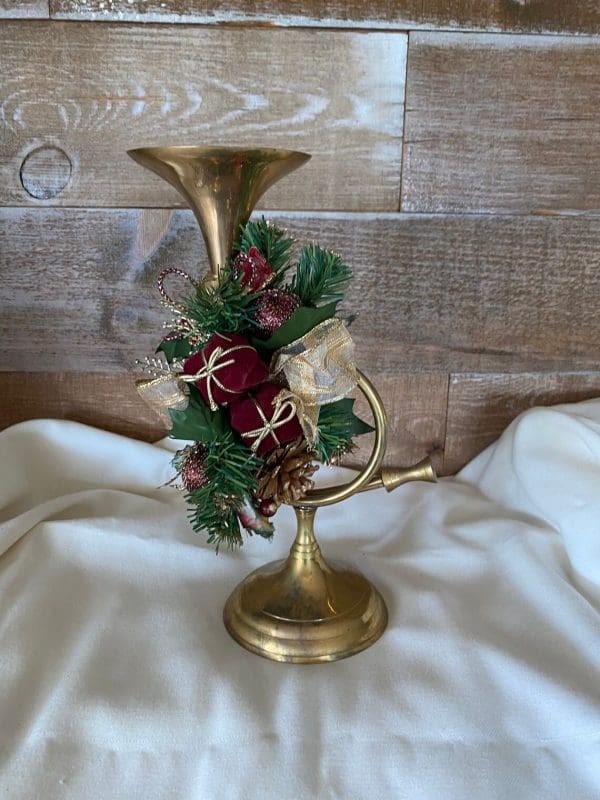 brass French horn candle holder front