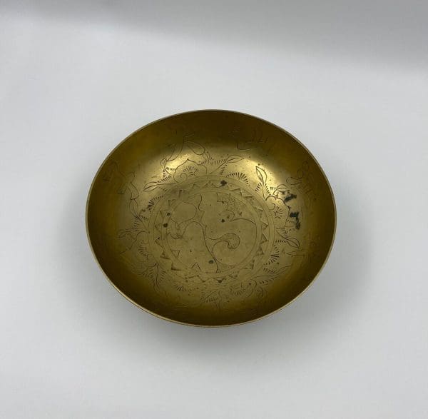 Chinese brass dragon bowl top view showing the embossed design