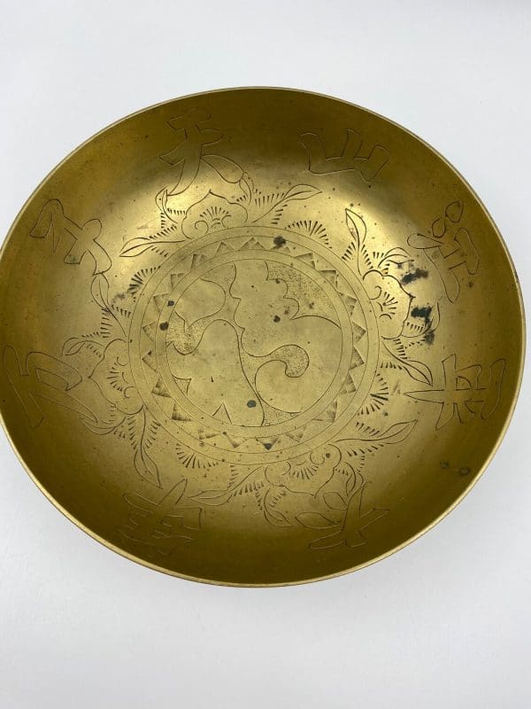 Chinese brass dragon bowl close of inside of bowl