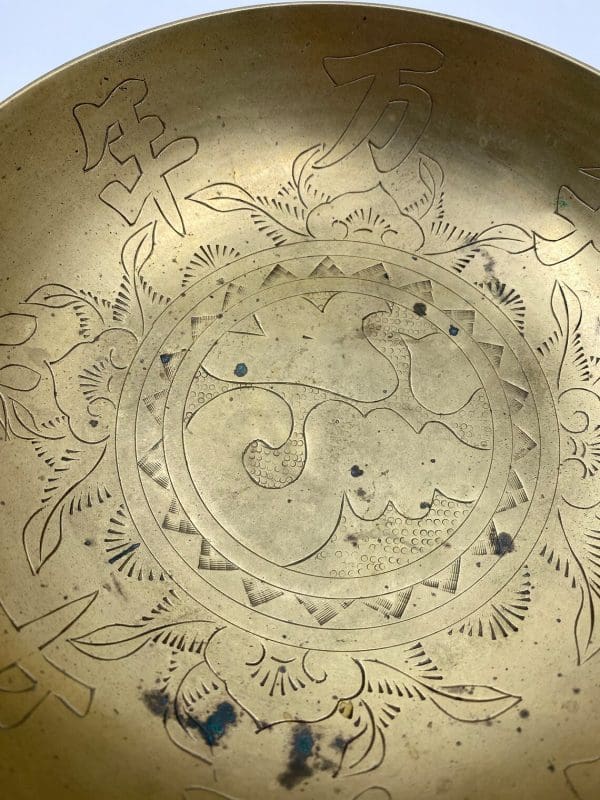 Chinese brass dragon bowl close view of bowl patina and detail work on brass