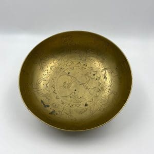 Chinese brass dragon bowl on edge showing details