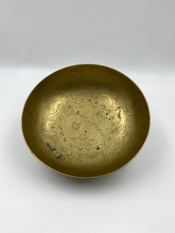 Chinese brass dragon bowl on edge showing details