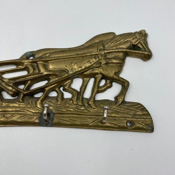 key holders for the wall close of horses brass