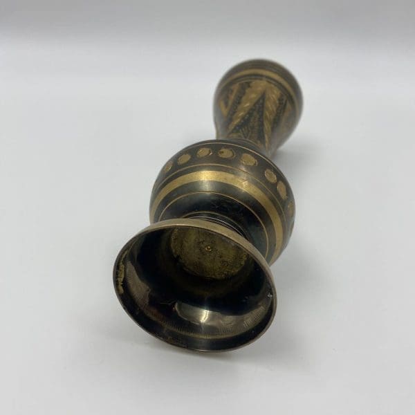 black and brass vase bottom