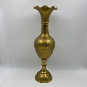 vintage brass etched vase standing alone