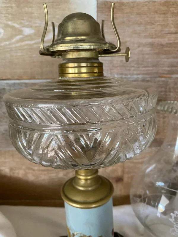 antique oil lamp with cast iron base pressed glass oil reserve