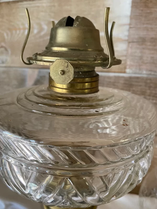 antique oil lamp with cast iron base close view of burner