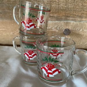 clear glass Christmas mugs stacked