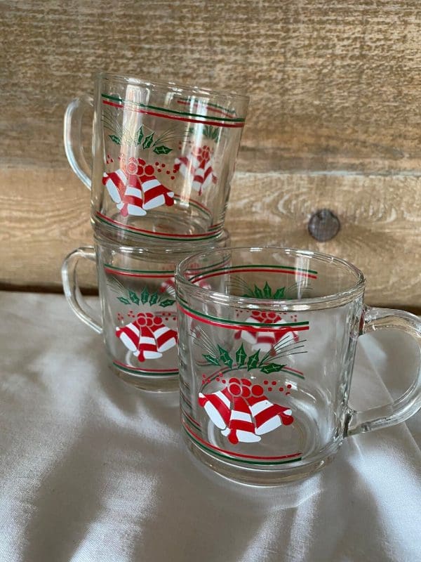 clear glass Christmas mugs stacked