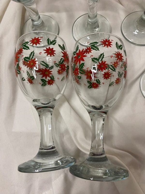 vintage Christmas wine glasses laying on side