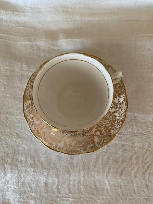 Colclough china tea cup pink, white and gold floral top view