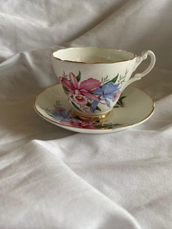 Consort tea cup with flowers design pink and blue daffodils straight forward view