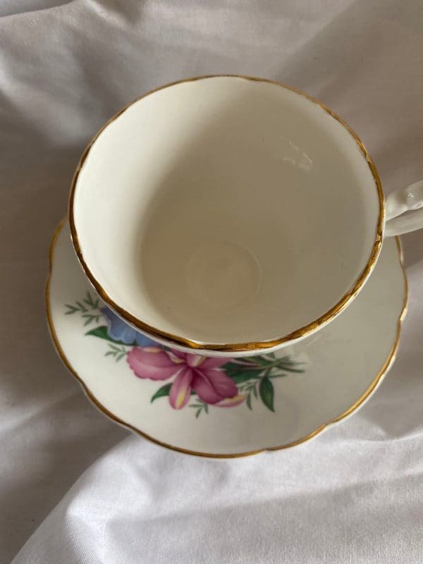 Consort tea cup with flowers design tea cup on saucer top view