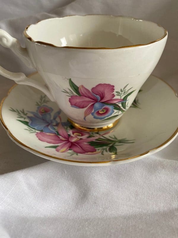 Consort tea cup with flowers design pink and blue daffodils gold trim.view 2