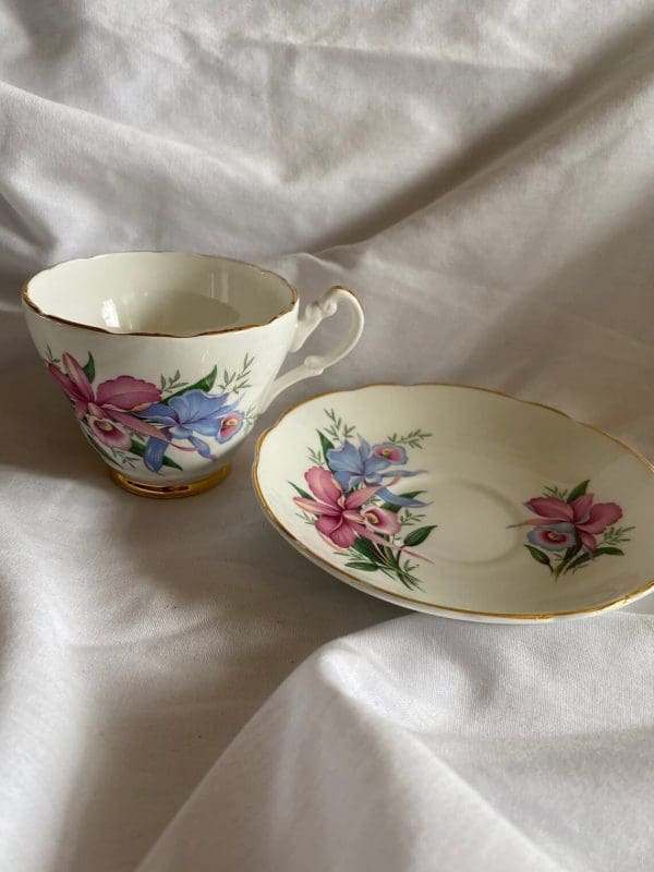 Consort tea cup with flowers design pink and blue daffodils gold trim with saucer