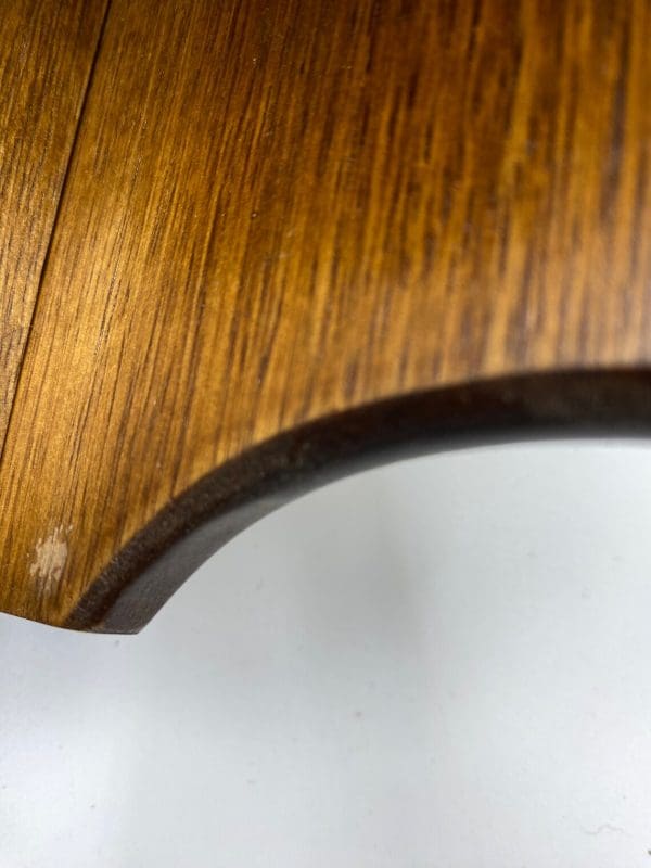 vintage wood corner shelf scuff marks close