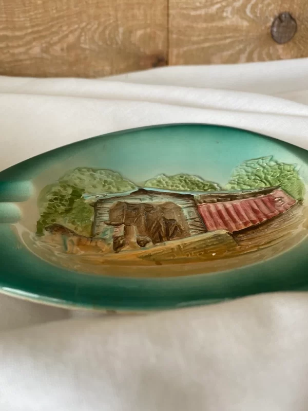 Porcelain ashtray vintage covered bridge depiction flat view