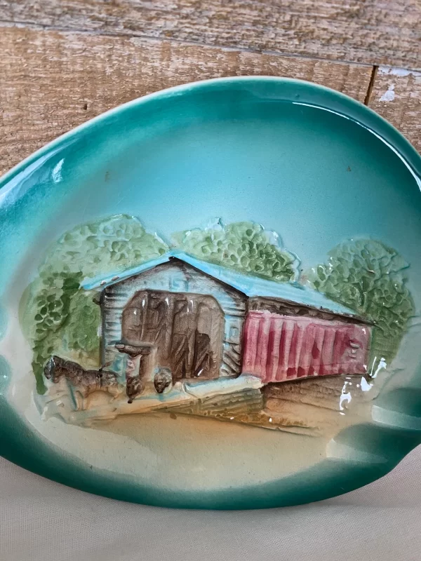 Porcelain ashtray vintage covered bridge depiction closeup 3