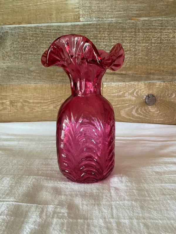 cranberry glass vase vintage on shelf