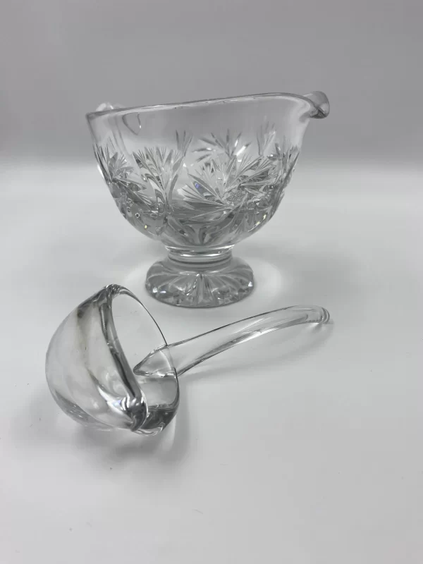 crystal gravy boat close of ladle