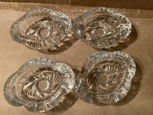 Pinwheel crystal ashtrays vintage set of four top view