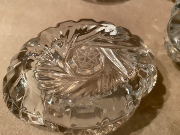 Pinwheel crystal ashtrays vintage set of four bottom close