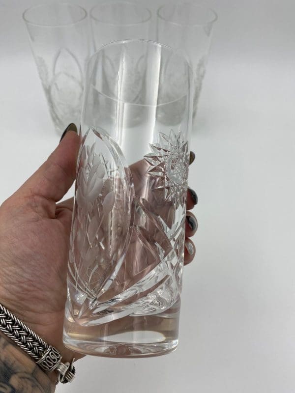 crystal drinking glasses in hand to show size