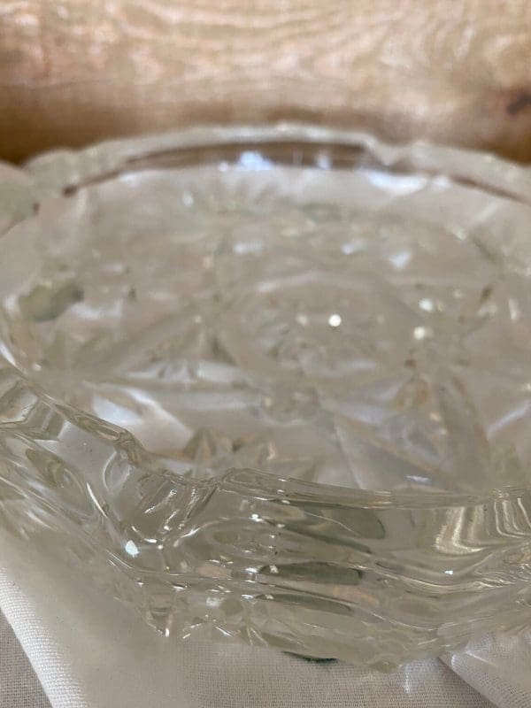 Vintage round glass ashtray close up two