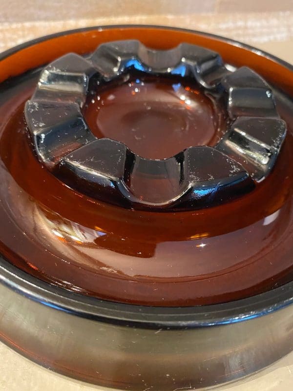 Vintage glass cigar ashtray dark amber, round closeup 3