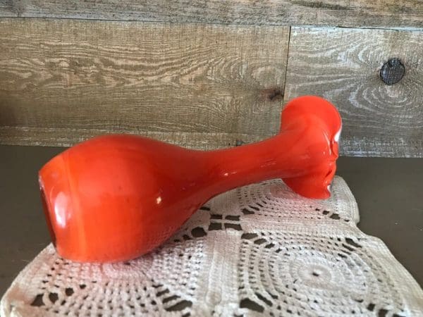 orange glass vase vintage laying