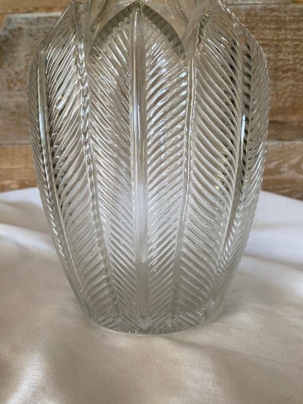 vintage clear glass vases close up of feather