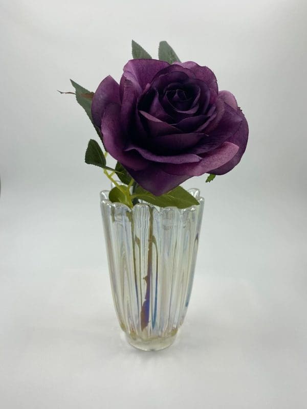 iridescent glass vase with flower