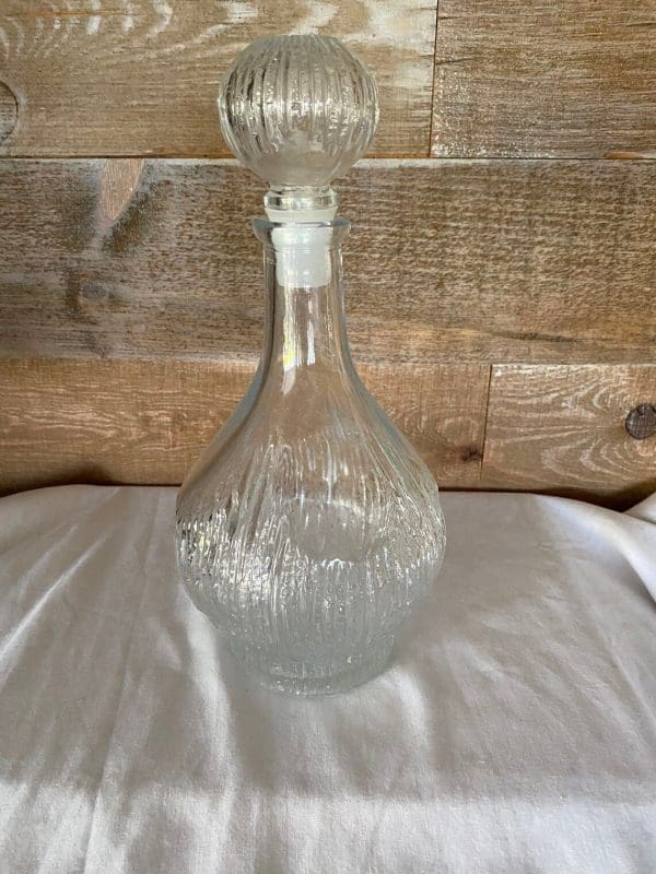 vintage liquor decanters tree bark texture in clear glass