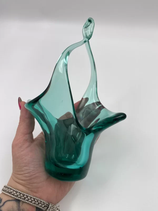 vintage green glass basket in hand to show size