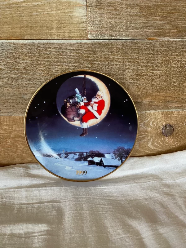 1999 Avon Christmas plate front Santa sleeping on the crescent moon