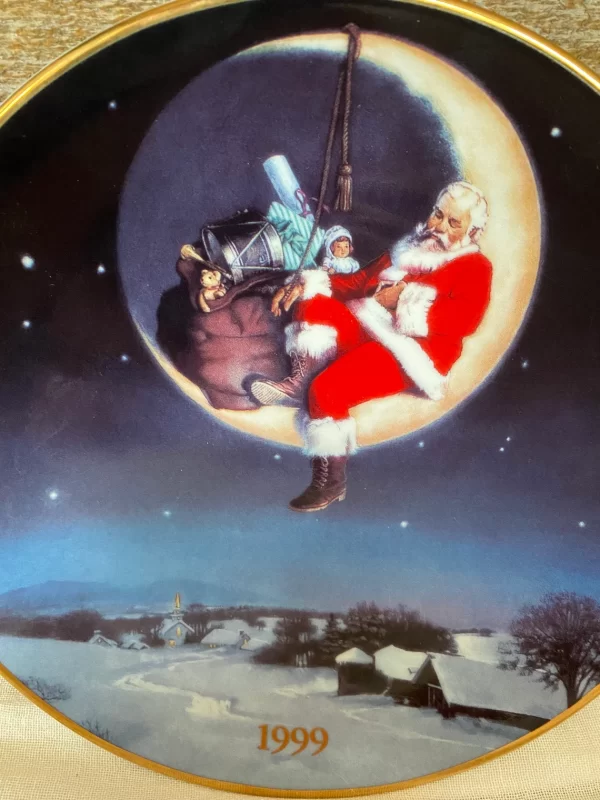 1999 Avon Christmas plate night sky with Santa sleeping on the moon with a bag of toys