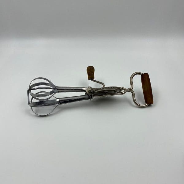 vintage egg beater on side